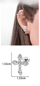 Detail view of silver cross earring with micro-paved clear and pink cubic zirconia