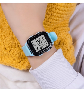 Close-up of light blue silicone digital watch on wrist with square black display
