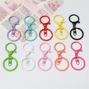Detailed view of ten colorful matte lacquer lobster clasps and metal key ring hardware