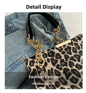 Detailed close-up of leopard print shoulder bag with gold chain strap and metal trim