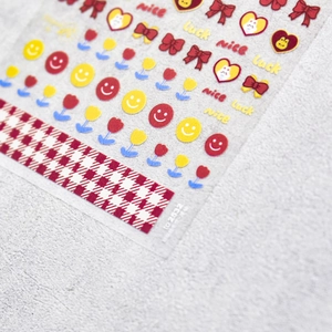Detailed macro view of 5D nail stickers featuring cute rabbits and tulip floral patterns