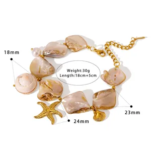 Detail of beach style bracelet with natural shell, pearl, and gold starfish charms