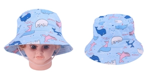 Detail of light blue baby sun hat with whale prints and adjustable white chin strap