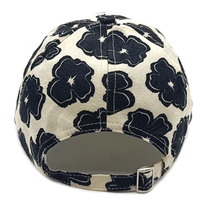 Close-up of baseball cap back with floral jacquard pattern and adjustable metal buckle
