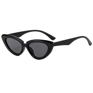 Chic women's cat eye sunglasses in glossy black frame with dark grey fashion lenses