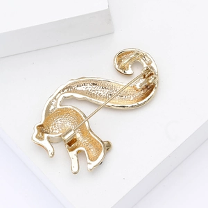 Detail showing the golden alloy squirrel brooch back structure and secure safety pin