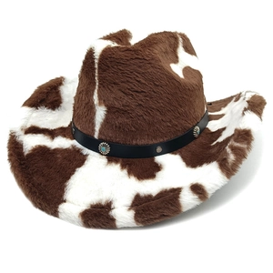 Detail of faux fur cow print cowboy hat with turquoise metal flower concho belt