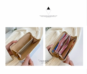 Detail view showing multi-slot interior of a long zipper wallet with card and cash storage