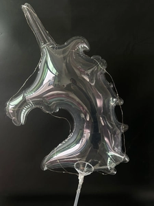 Detail of LED luminous unicorn balloon with iridescent PVC material and light string