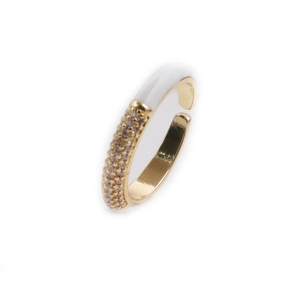Macro view of gold adjustable ring with white enamel and pavé zircon stones detail