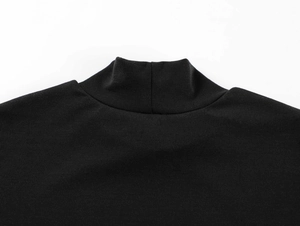 Close-up of the vintage black mock neck t-shirt showing fine knit fabric texture