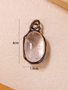 Detail showing natural crystal pendant dimensions of 4cm height and 1.9cm width