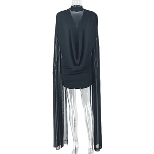 Detail of black long-sleeved dress featuring draped neckline and fitted bodycon style