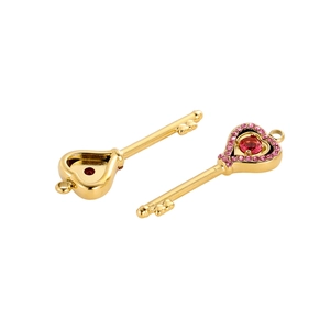 Golden heart-shaped key pendant featuring pink rhinestones and a deep red center gemstone