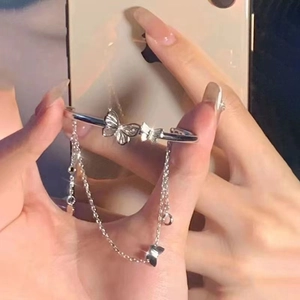 Silver butterfly bracelet with shell inlay, fringe chain, and open cuff design for women