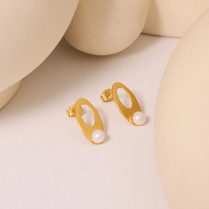 Vintage style gold hollow oval pearl stud earrings made of high-quality stainless steel