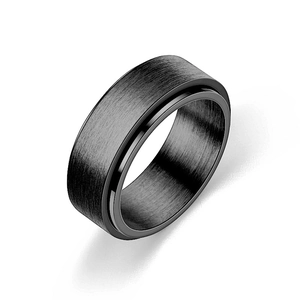 Close-up of black rotatable anxiety ring with brushed finish and polished edges