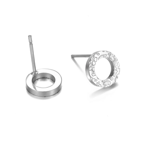 Minimalist silver round stud earrings with unique hammered texture and polished metal finish