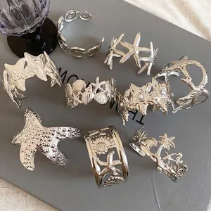 Silver wrinkled starfish open bangle with marine shells and seahorse hollow design