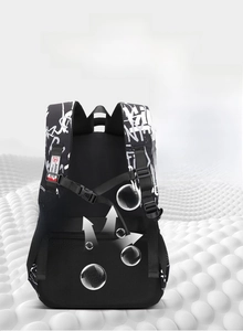 Detail of the breathable honeycomb mesh back panel and adjustable chest strap on the backpack