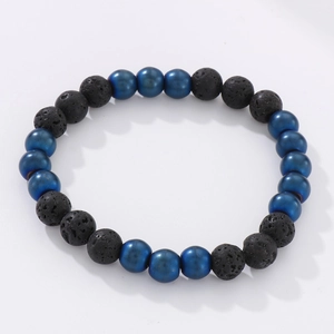 Detail of 8mm black lava stone and matte blue beads on a handcrafted beaded bracelet