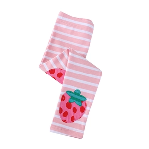 Pink and white striped leggings for girls with cute strawberry patch details