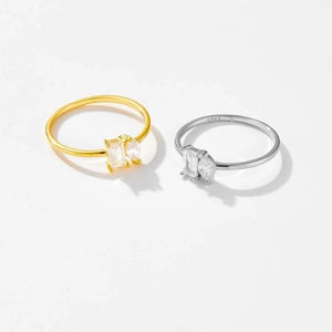 Detail of S925 silver rings with baguette and marquise cut cubic zirconia stones