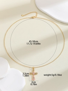 Detail view of pink enamel cross necklace with size specs: 3.5cm pendant on 50cm gold chain