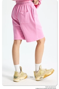Detail of pink cotton shorts showing high-quality washed fabric and elastic waistband