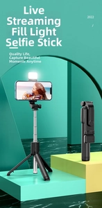 Close-up of foldable selfie stick tripod with integrated LED fill light and black finish