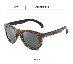 Detail view of children's leopard print camouflage sunglasses with dark lenses