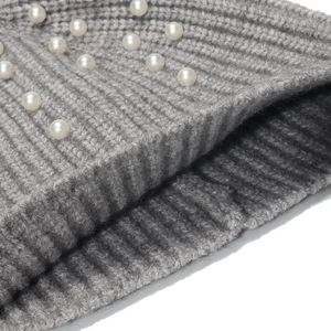 Grey ribbed knit beanie for women with elegant white pearl embellishments for winter warmth