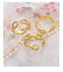 Detailed close-up of a 3-piece set of 18K gold plated rope textured open chain rings