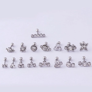 Assorted 20G stainless steel helix studs with clear zircon stones on light background