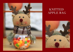 Detail of Christmas reindeer candy jar with knitted head and transparent base for treats