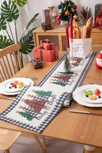 Detail of Christmas table runner with plaid trees and Merry & Bright holiday greetings