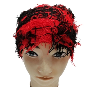 Punk style red and black distressed knit beanie hat with frayed thread detailing