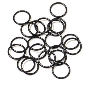 Pile of 8-10mm black macaron painted open jump rings for DIY jewelry making