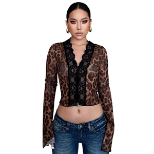 Detail of leopard print mesh top with delicate black lace trim and V-neckline