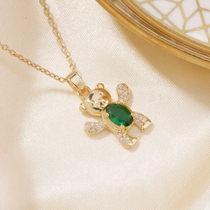 Elegant golden bear pendant necklace with green oval gemstone and white cubic zirconia