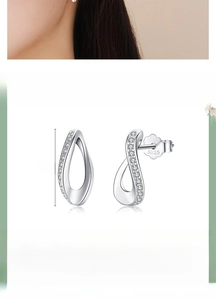 Detail view of 925 sterling silver infinity teardrop earrings with cubic zirconia stones
