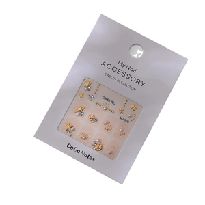 Nautical 3D nail art charms set with gold seashells, starfish, pearls, and blue rhinestones