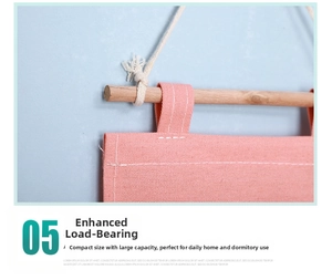 Detail of pink canvas wall hanging bag with wooden rod and heavy duty bearing capacity