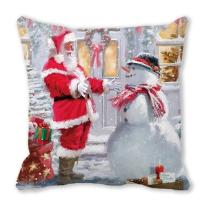 Detail of Christmas pillow featuring a Santa and snowman print with Dear Santa text