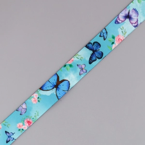 Detail of light blue lanyard with printed butterflies and floral satin ribbon texture