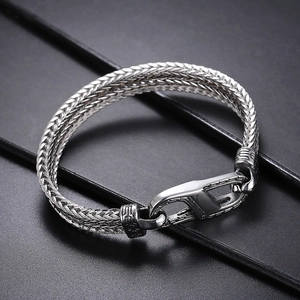 Retro stainless steel dragon bone chain bracelet with large lobster clasp on black background