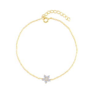Detail of gold flower bracelet featuring sparkling white crystal petals on a slim cable chain