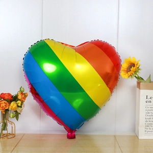 Rainbow heart-shaped foil balloon for Valentine's day party decor on white background