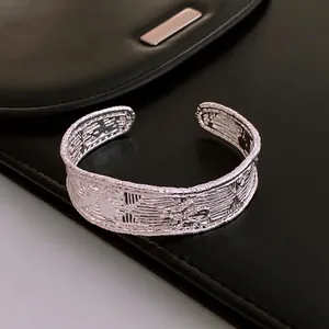 Vintage gold plated mesh open bangle with intricate embossed patterns for women