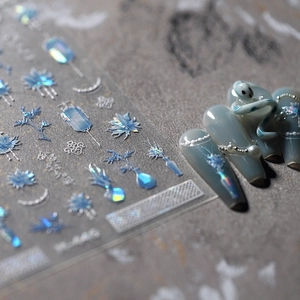 Laser holographic light blue nail stickers with traditional floral and knot patterns